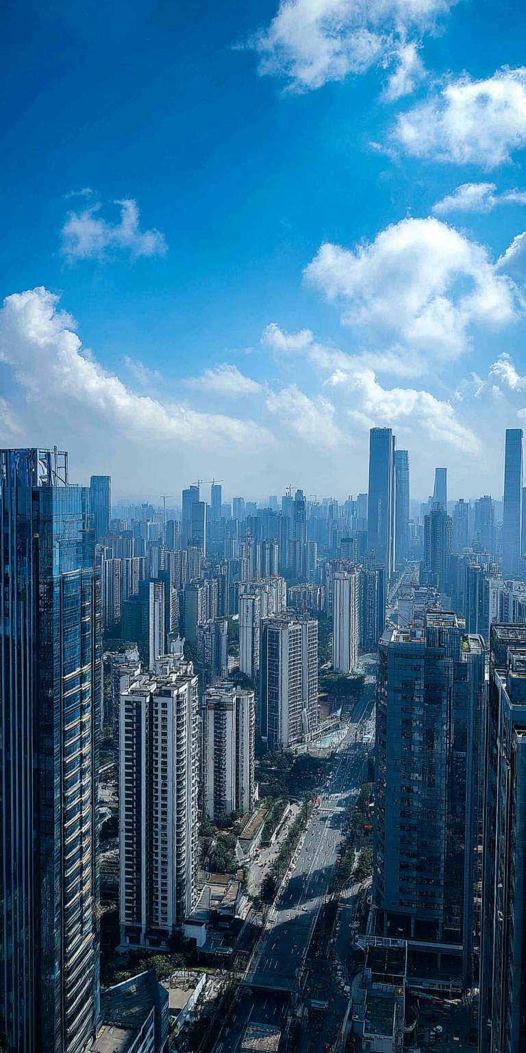 从高处俯瞰现代化大都市，众多摩天大楼林立，玻璃幕墙在阳光下熠熠生辉，城市街道穿插其间，上方是晴朗的蓝天和少量白云，氛围开阔且充满现代感。 --ar 1:2 --v 7 --stylize 100 --fast --no 水印